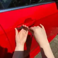 Auto locksmith opening locked car door in Evesham UK
